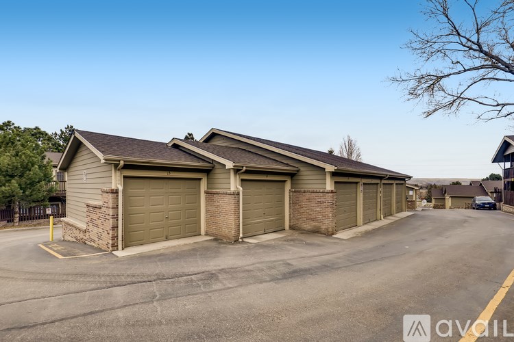A row of garage doors in front of a building.