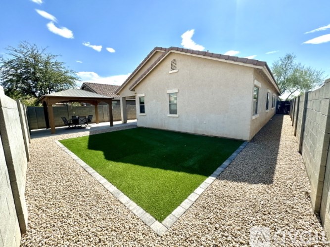 A house with a small garden in front.