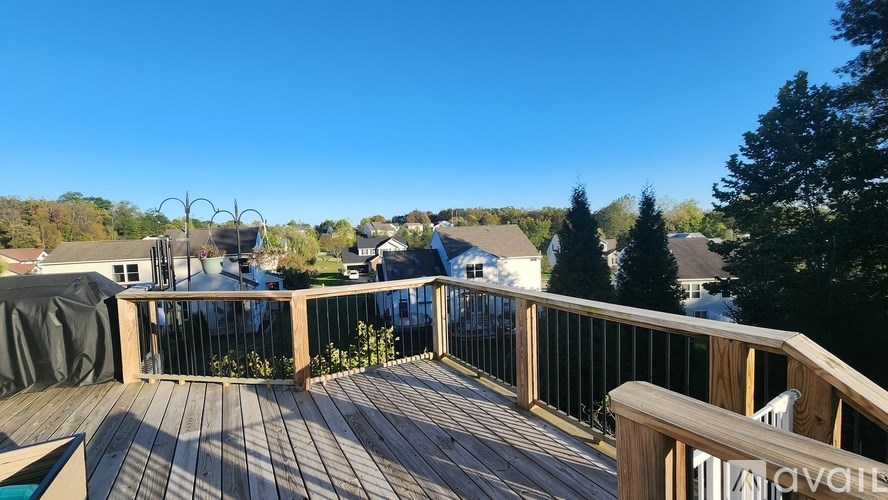 A wooden deck with a pool table and a sign that says "available".