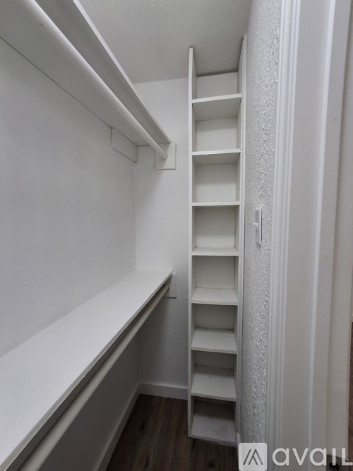 A white ladder in a white room.