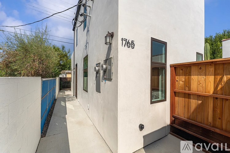 A white building with the number 1765 on it.