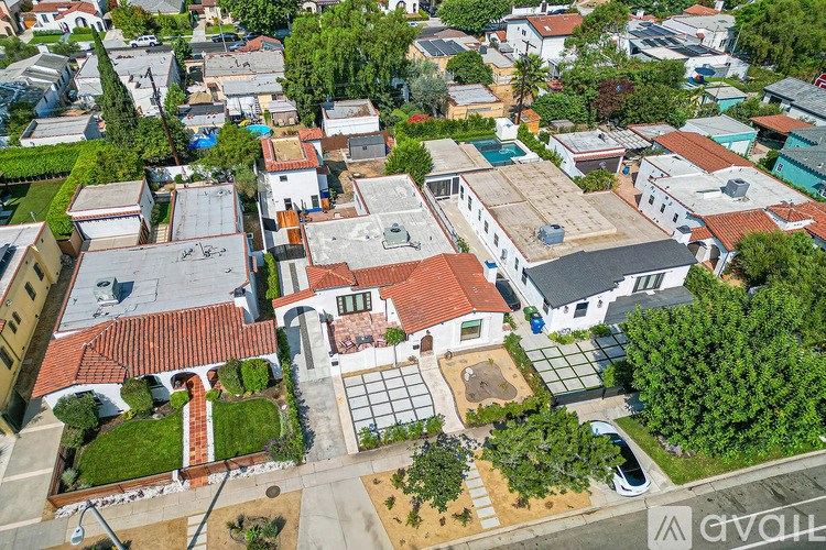 A bird's eye view of a residential area with houses and trees.