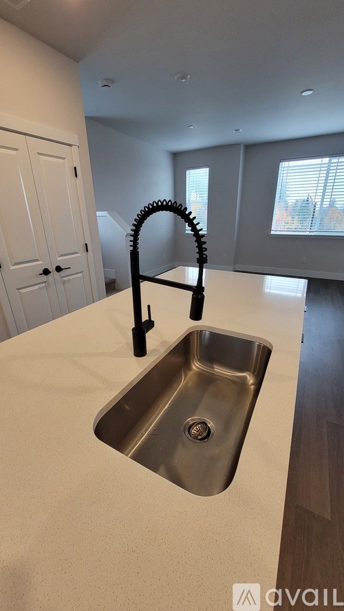 A modern kitchen with a sink and a faucet.