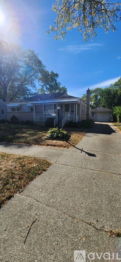 A house with a driveway in front of it.