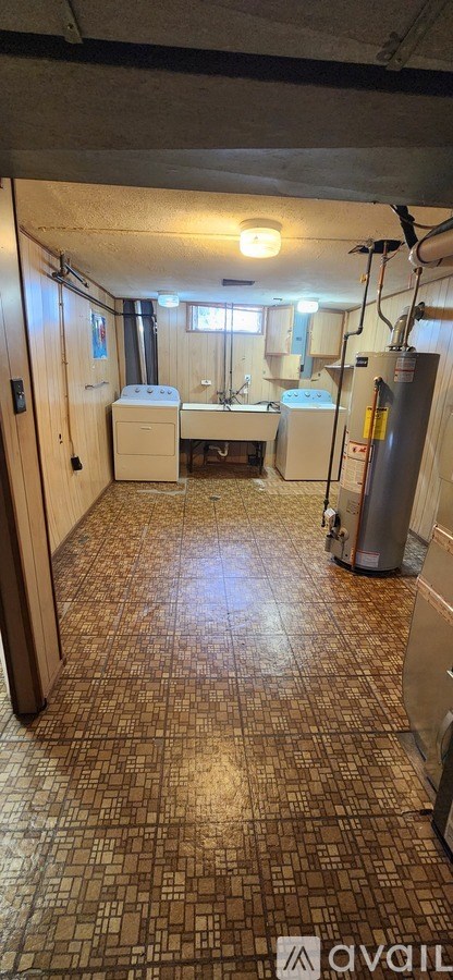 A room with a tiled floor and a window.