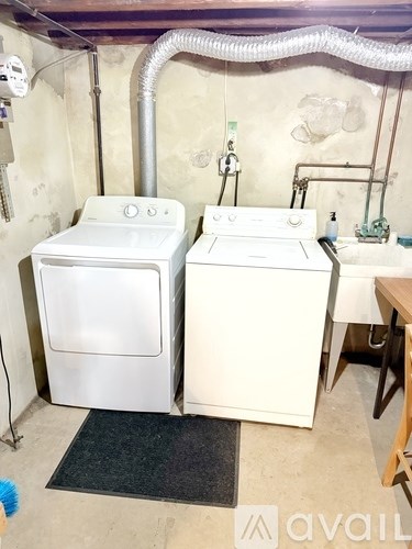 A laundry room with a washer and dryer.