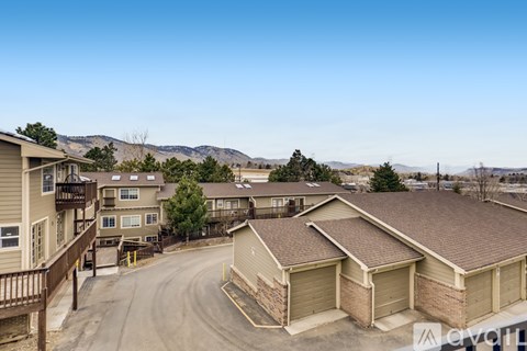 A residential area with houses and a clear sky.