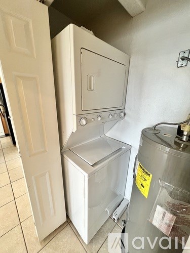 A white oven and a white fridge in a kitchen.