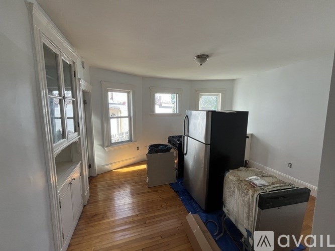 A kitchen with a fridge and a freezer.
