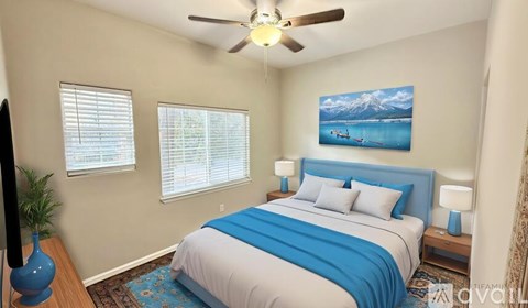 A bedroom with a bed, a ceiling fan, and a painting of a mountain scene on the wall.