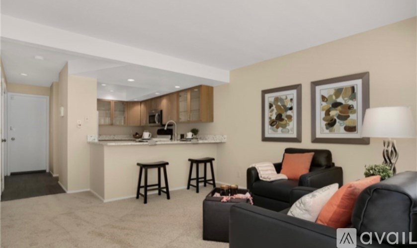 A living room with a bar area and a couch.
