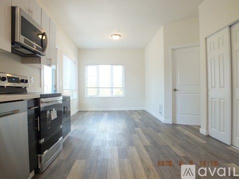 A kitchen with a stove top oven and microwave above it.