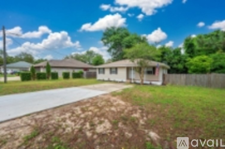 A house with a driveway in front of it.