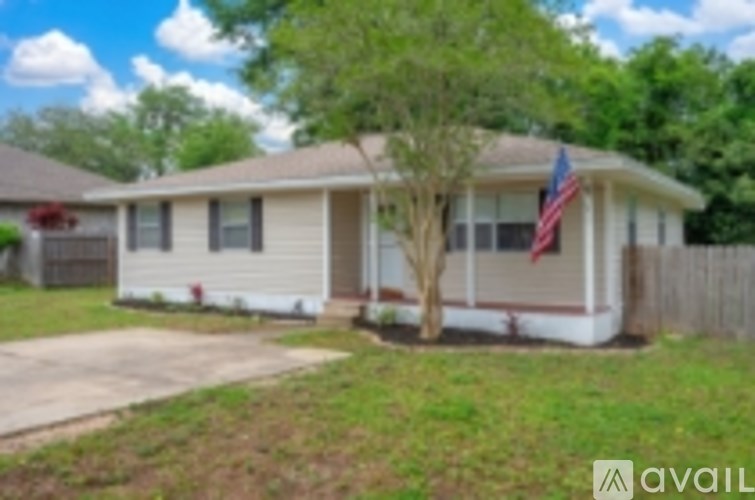 A house with a flag on the front porch.
