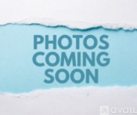 A torn paper reveals the text "PHOTOS COMING SOON".