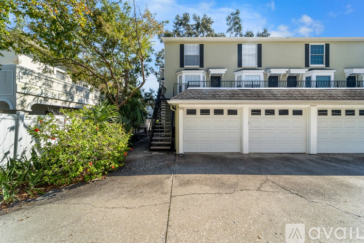 A house with a white garage door is for sale.