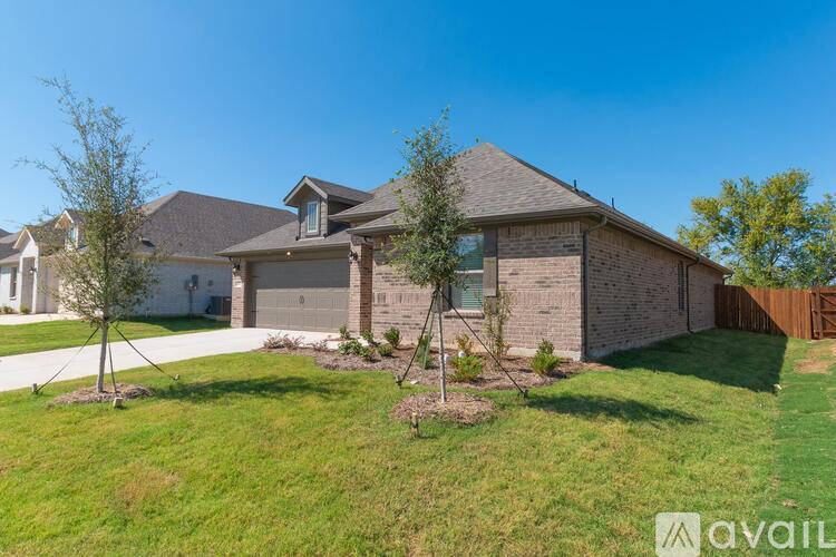 A house with a brown roof and a white garage door.