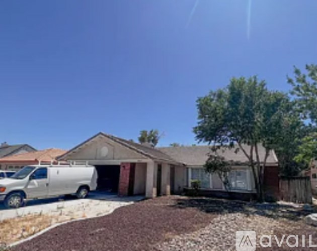 A house with a white van parked in front.