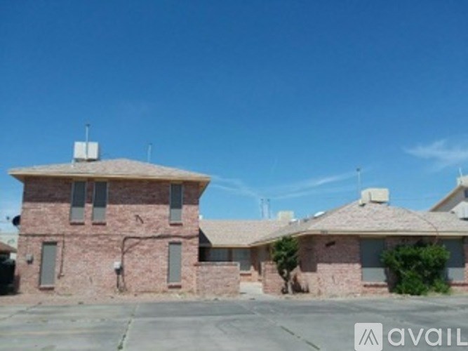 A house with a clear blue sky in the background.