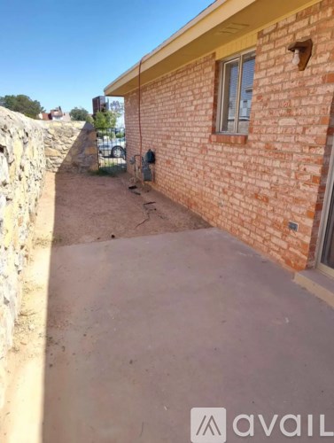 A brick house with a window and a door.
