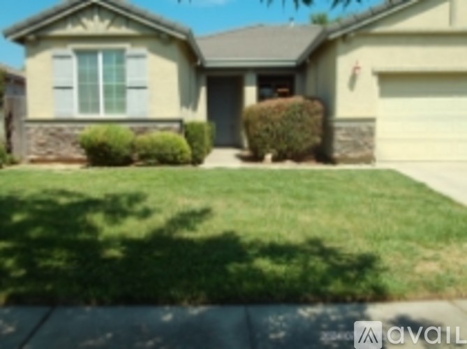 A house with a garage and a driveway.