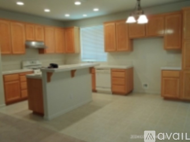 A kitchen with wooden cabinets and a white counter.