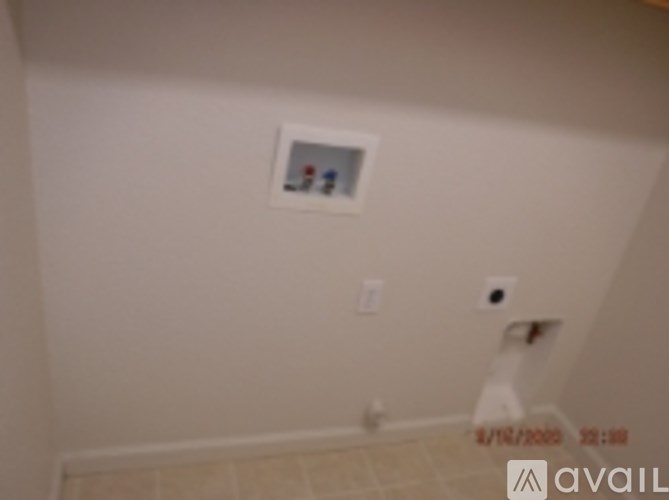 A picture frame with a picture of a dog and a cat is hanging on the wall.