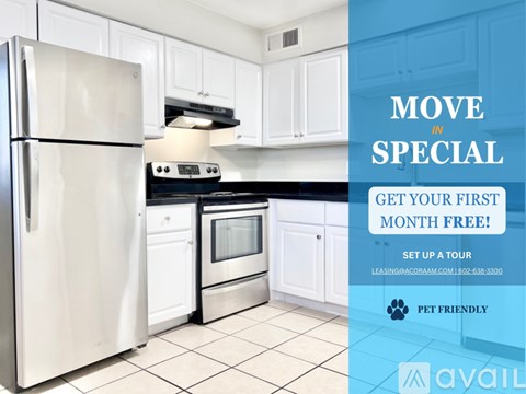 A kitchen with a refrigerator, oven, and cabinets is on sale for a first month free.