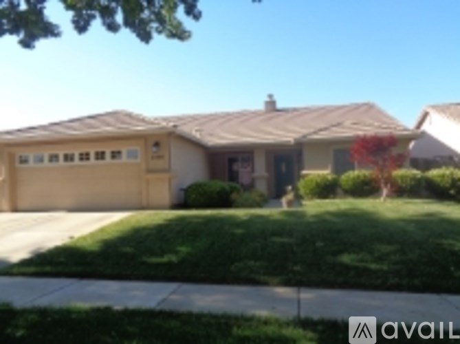 A house with a garage is for sale.