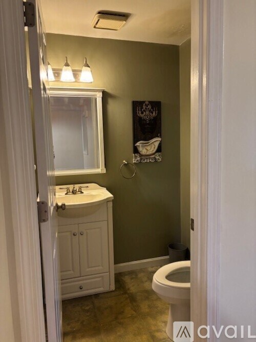 A staircase with wooden steps and a white railing.