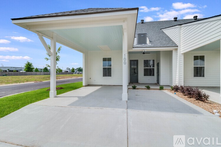 A house with a covered patio area is for sale.