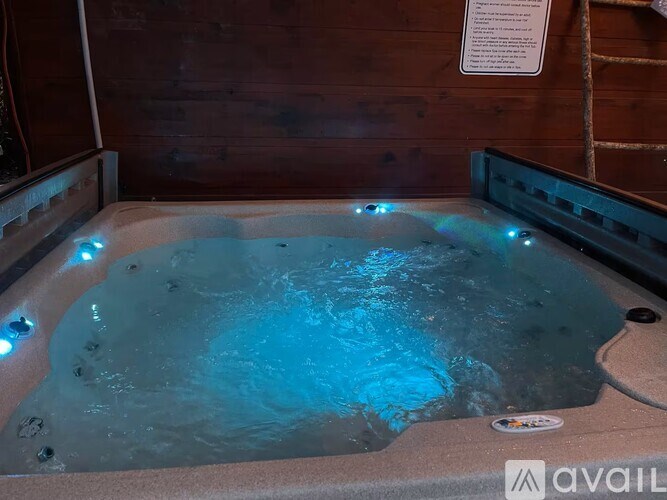 A hot tub with blue lights in the middle of it.