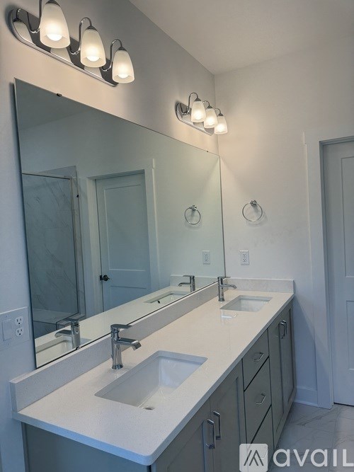 A bathroom with a sink and mirror.