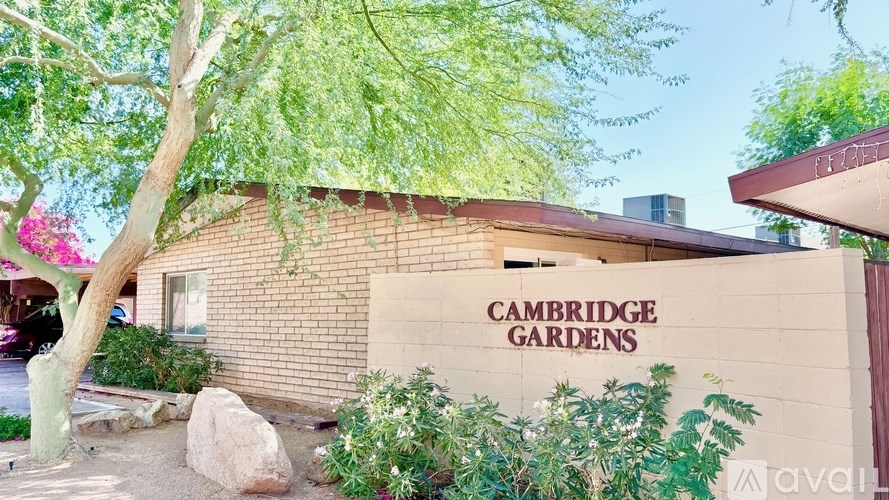 A building with the words Cambridge Gardens on it.