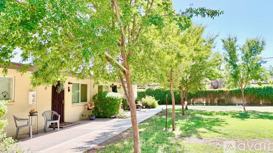 A house with a tree in front of it.