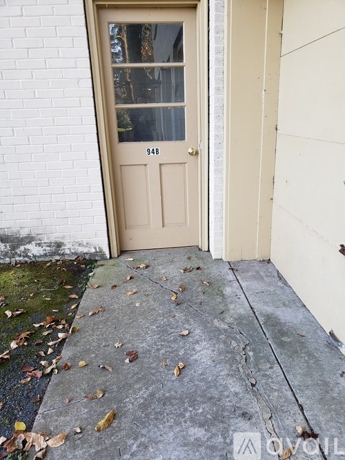 A beige door with the number 948 on it.