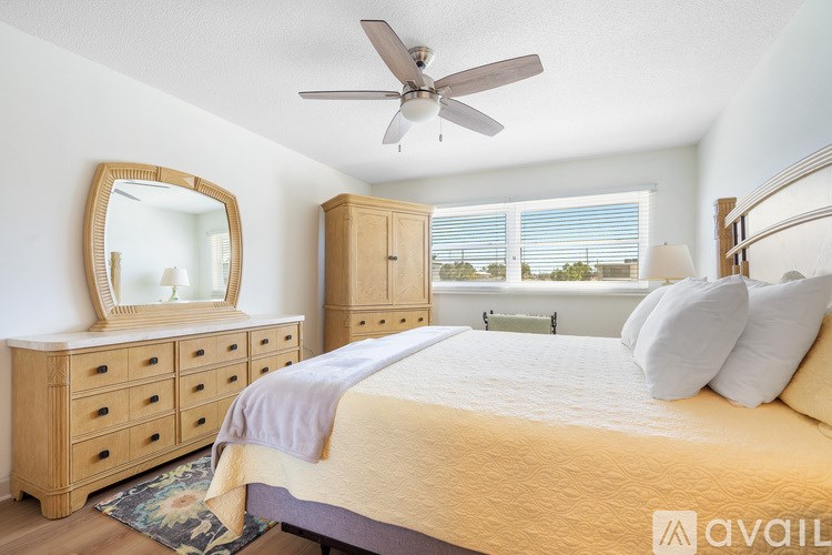 A bathroom with a walk-in shower and a white door.