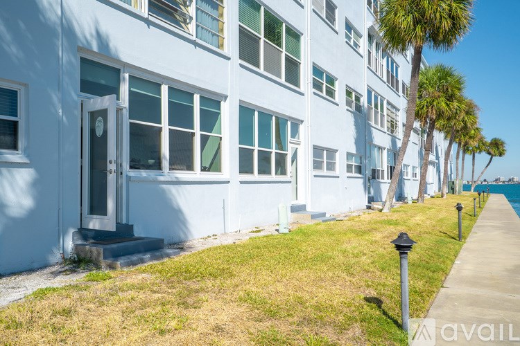 A bathroom with a toilet, sink, and shower.