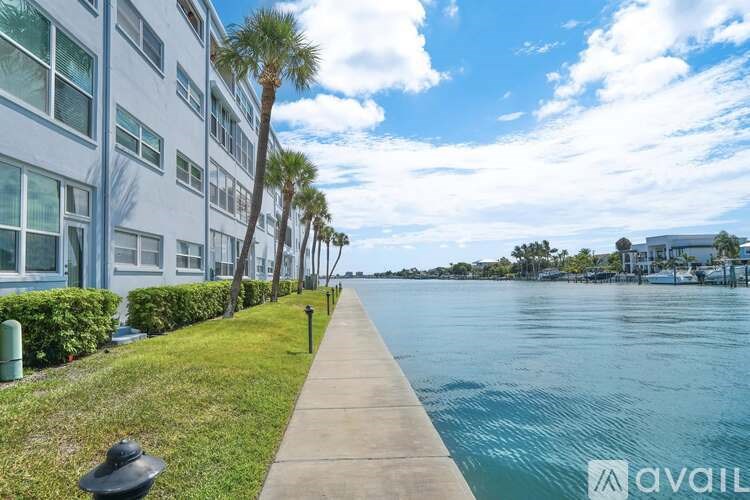 A building with a balcony overlooking a body of water.