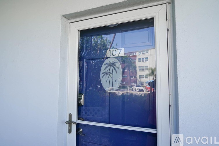 A window with a view of a street and buildings.
