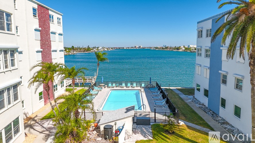 A kitchen with a fan and a painting on the wall.
