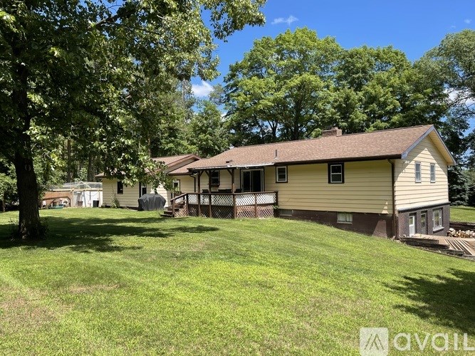 A house with a lawn in front of it.