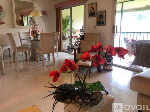 A living room with a glass table and chairs.