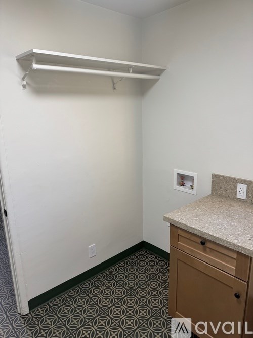 A small room with a drawer and a counter.