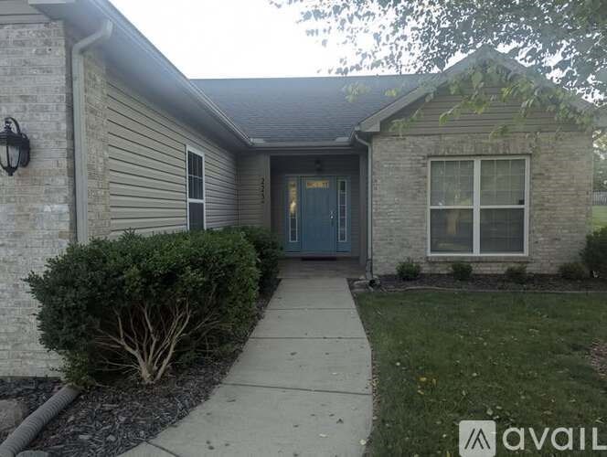 A house with a blue door and a window is for sale.