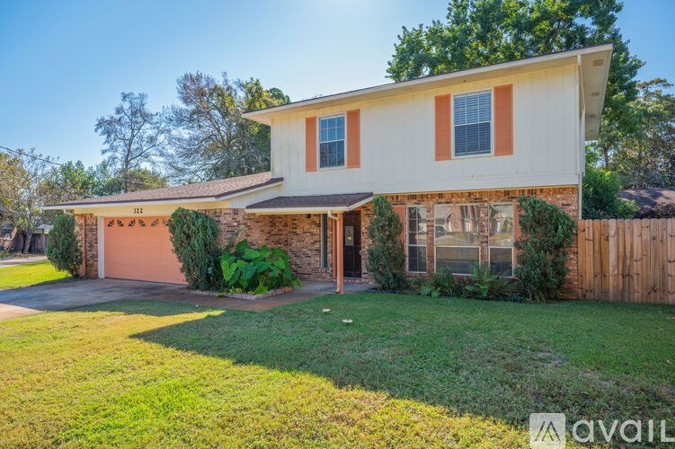 A house with a brown garage door and a white wall.