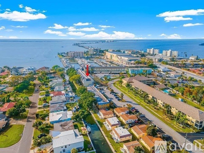 A bird's eye view of a residential area with a road running through it.
