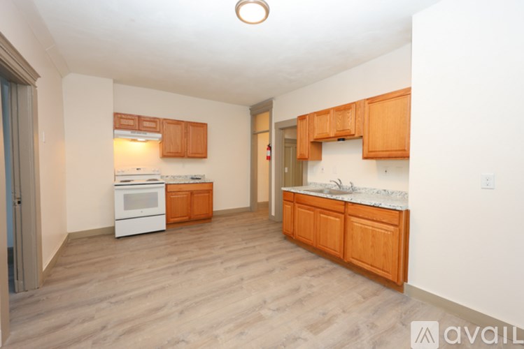 A bird's eye view of a town with a large white building with a dome in the center.