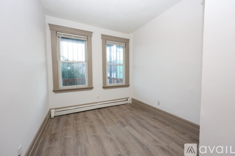 A kitchen with wooden cabinets and a white oven.