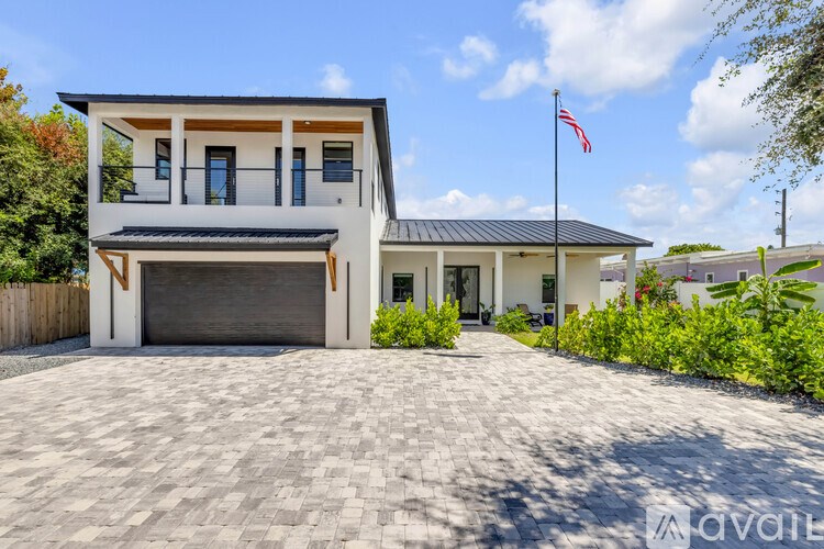 A modern house with a flag on the front.